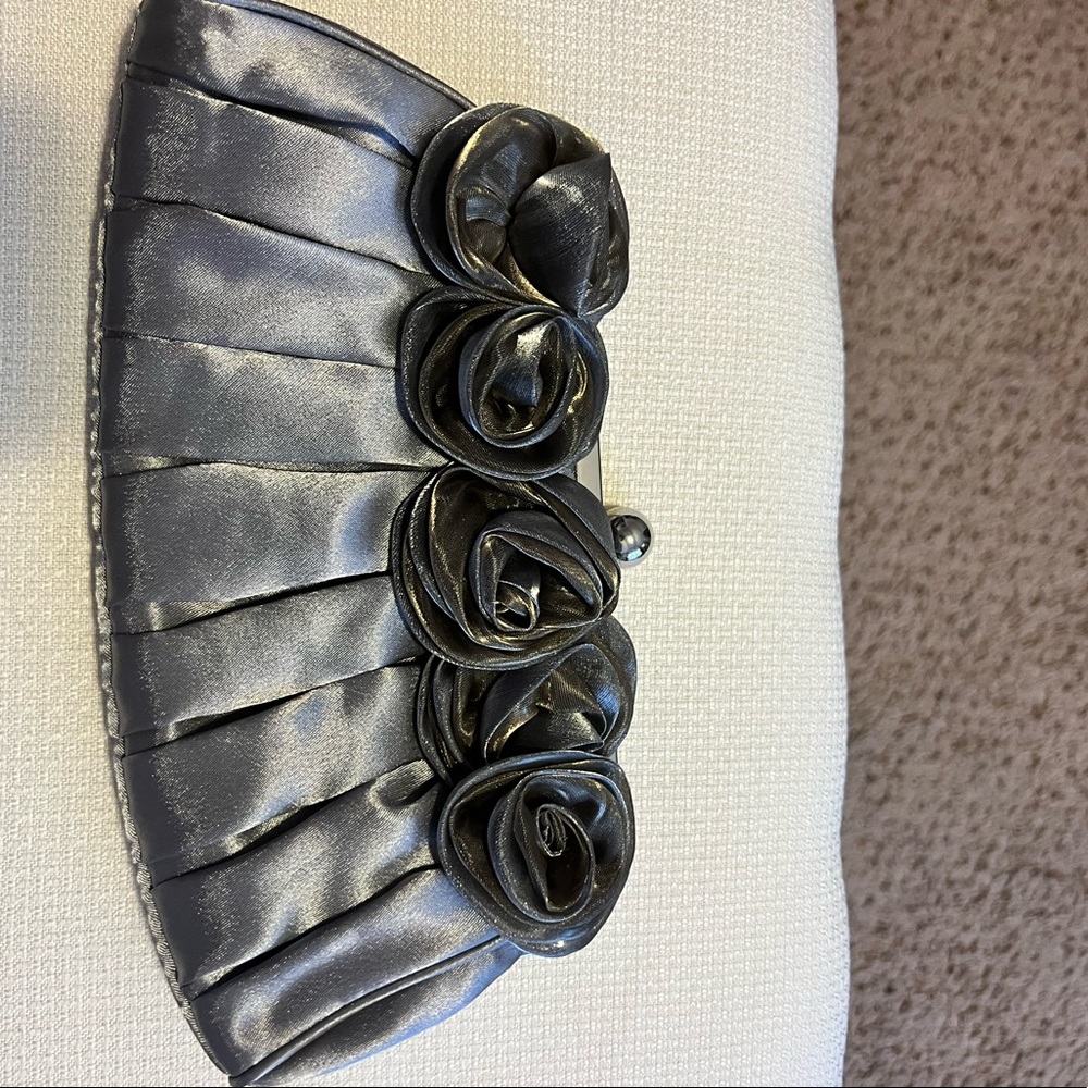 Cute silver evening bag with rosettes